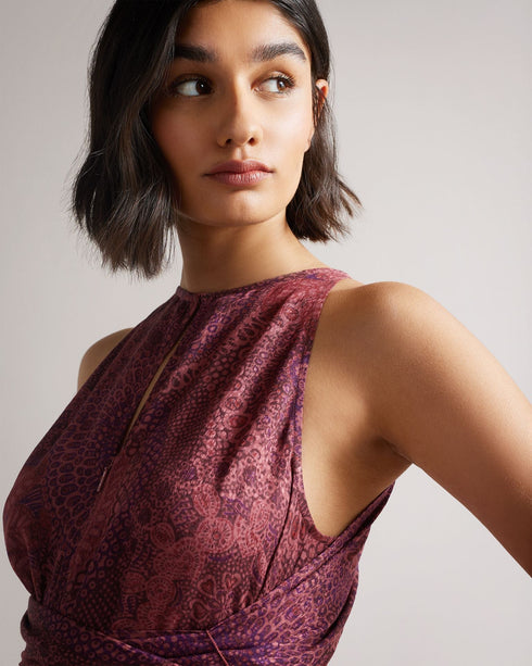 ODESIA-Trousers-Embrace playful prints and flowing shapes this season. ODESIA features our Paisley print and a wrap-around style, which creates a flattering silhouette for day and night outings.This product is made using LENZINGâ„¢ ECOVEROâ„¢ fibers. LENZINGâ„¢ ECOVEROâ„¢ fibers are derived from sustainable wood and pulp, coming from certified and controlled sources, with up to 50% lower emissions and water impact compared to generic viscose. LENZINGâ„¢ and ECOVEROâ„¢ is a trademark of Lenzing AG. Ted Baker
